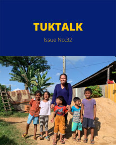 TukTalk Issue No. 32 cover showing a woman and children standing together beside a pile of sand