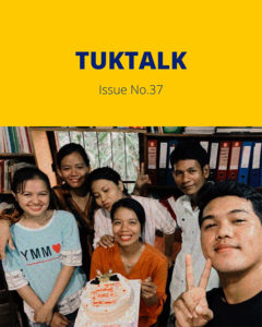 TukTalk Issue No. 37 cover with a group of young people smiling around a cake, one making a peace sign