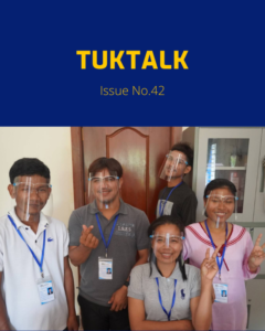 TukTalk Issue No. 42 cover with five staff in face shields smiling and making peace signs