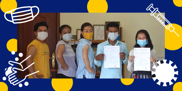 TukTuk staff in face masks hold their vaccination papers, framed by mask, syringe and handwashing icons