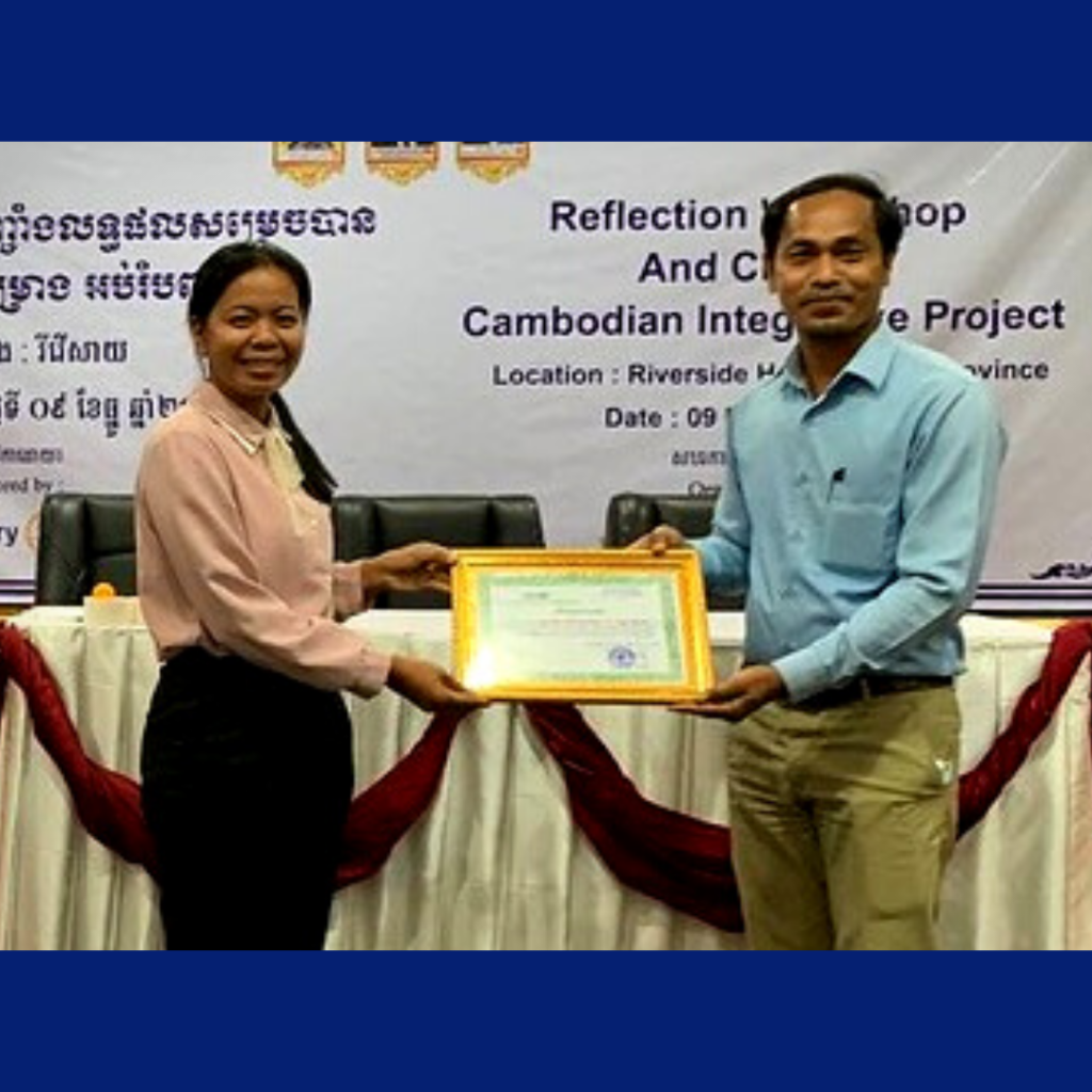 Two people hold a certificate at the CLIP reflection workshop for Cambodian Integrative Project partners