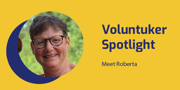 Voluntuker Spotlight banner with a smiling portrait of Norwegian volunteer Roberta