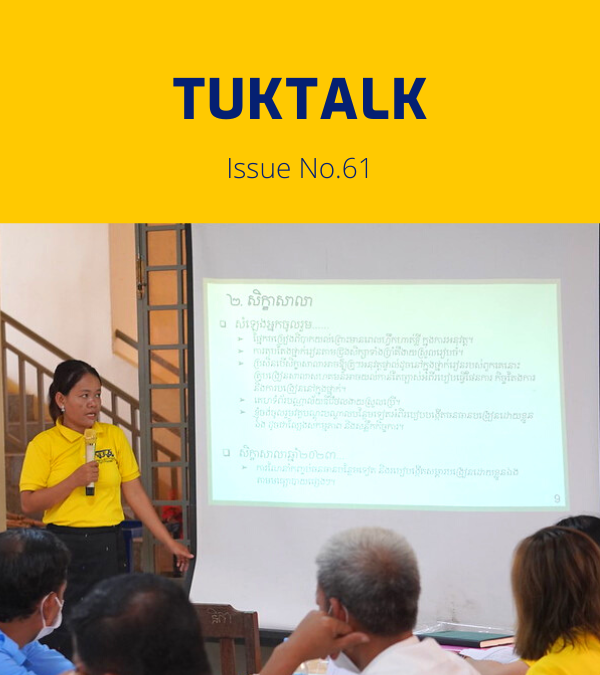 A TukTuk staff member in a yellow shirt presents slides at the annual meeting