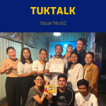 TukTuk staff and friends pose together at the New Year party, holding a certificate
