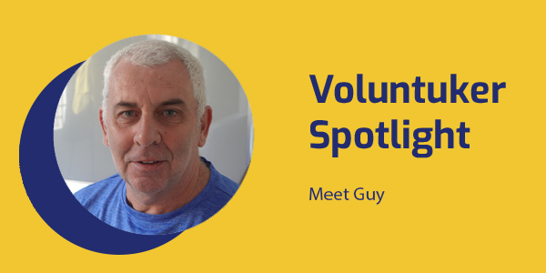 Voluntuker Spotlight banner with a smiling portrait of volunteer Guy