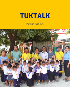 TukTalk 65 cover: preschool children in uniform raise their hands beside teachers and TukTuk staff
