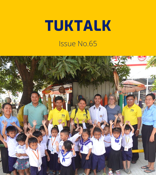 TukTalk 65 cover: preschool children in uniform raise their hands beside teachers and TukTuk staff