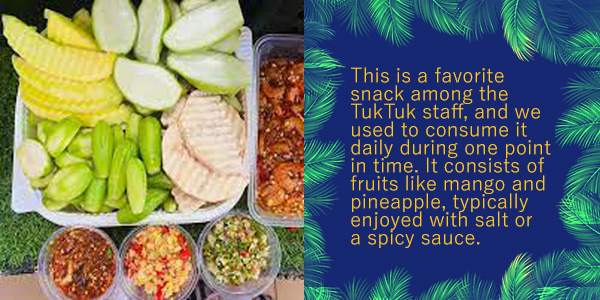 A plate of cut mango, pineapple and other fruit with spicy dips, with text on the TukTuk staff's favourite snack