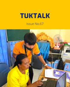 TukTalk 67 cover: a TukTuk staff member works at a laptop at a desk while a colleague looks on