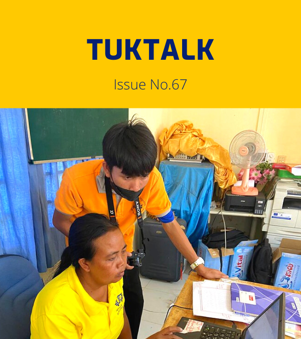 TukTalk 67 cover: a TukTuk staff member works at a laptop at a desk while a colleague looks on
