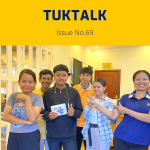 TukTalk 69 cover: TukTuk staff and the intern pose together in the office, holding a small photo