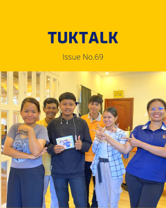 TukTalk 69 cover: TukTuk staff and the intern pose together in the office, holding a small photo