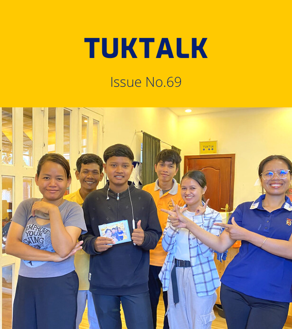 TukTalk 69 cover: TukTuk staff and the intern pose together in the office, holding a small photo