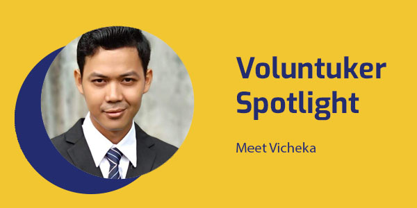Voluntuker Spotlight banner with a portrait of Vicheka of the Rotary Club of Pursat, in a suit and tie