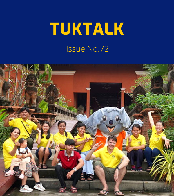 TukTalk 72 cover: TukTuk staff and visitors pose on temple steps with a koala mascot