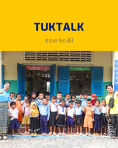 TukTalk issue 83 cover: a teacher and a class of preschool children pose together outside a school building