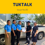 TukTalk issue 85 cover: TukTuk staff and visitors stand beside a pickup truck as documents are handed over