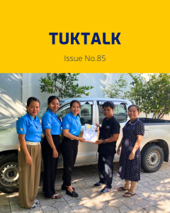TukTalk issue 85 cover: TukTuk staff and visitors stand beside a pickup truck as documents are handed over