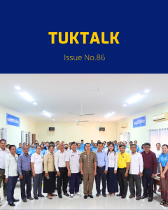 TukTalk issue 86 cover: officials, teachers and TukTuk staff pose together in a meeting hall after the CLIP3 annual meeting