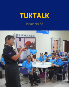 TukTalk issue 88 cover: a presenter shows a picture-book illustration to teachers seated at tables in a workshop