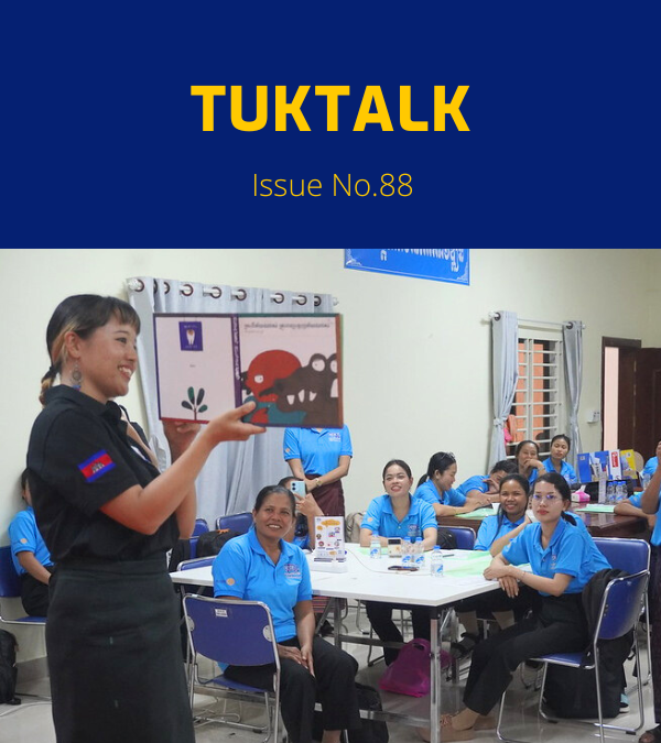 TukTalk issue 88 cover: a presenter shows a picture-book illustration to teachers seated at tables in a workshop
