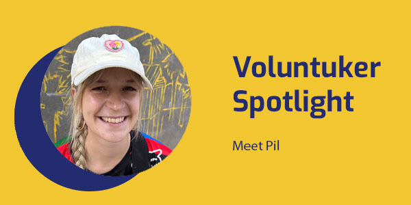 Portrait of Pil, an illustrator and mural artist, with the title Voluntuker Spotlight: Meet Pil