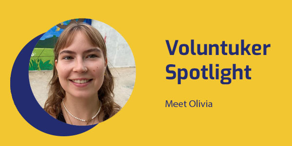 Portrait of Olivia, an Australian volunteer who painted the studio mural, with the title Voluntuker Spotlight: Meet Olivia
