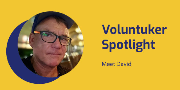 Portrait of David, a filmmaker and volunteer from Australia, with the title Voluntuker Spotlight: Meet David