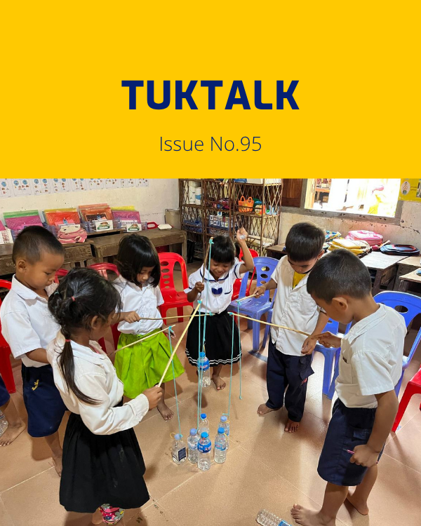 Preschool children play with sticks, string and water bottles in a classroom activity