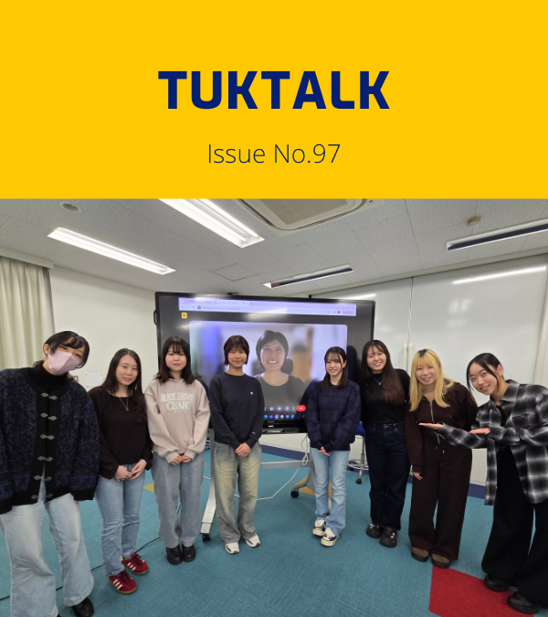 TukTalk issue 97 cover above a photo of university students posing in a classroom beside a screen