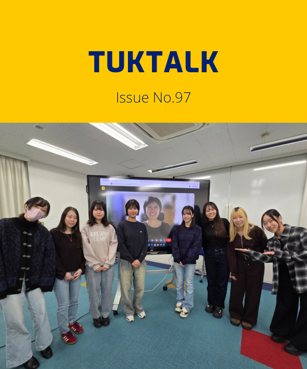 TukTalk issue 97 cover above a photo of university students posing in a classroom beside a screen