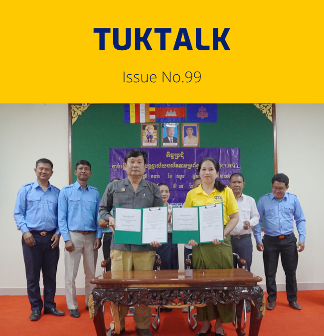TukTalk issue 99 cover above a photo of officials and TukTuk staff holding signed agreement folders at a table